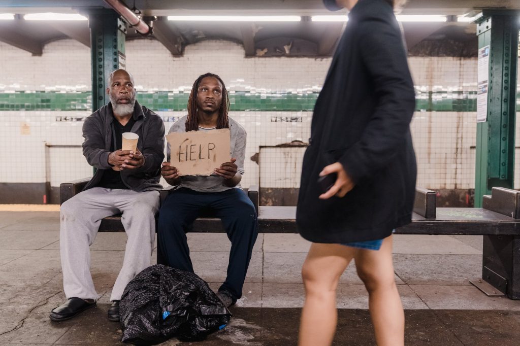 man in black suit jacket sitting beside woman in black coat